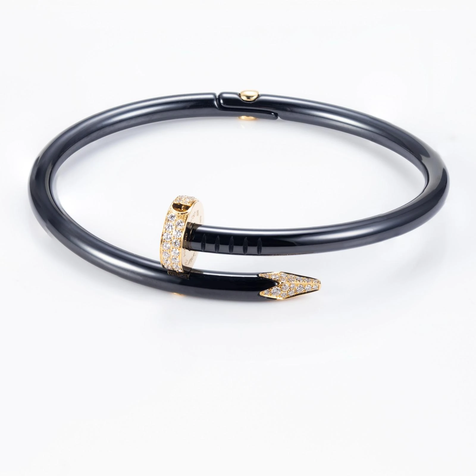 Black nail-form bracelet with gold-tone diamond-set tips