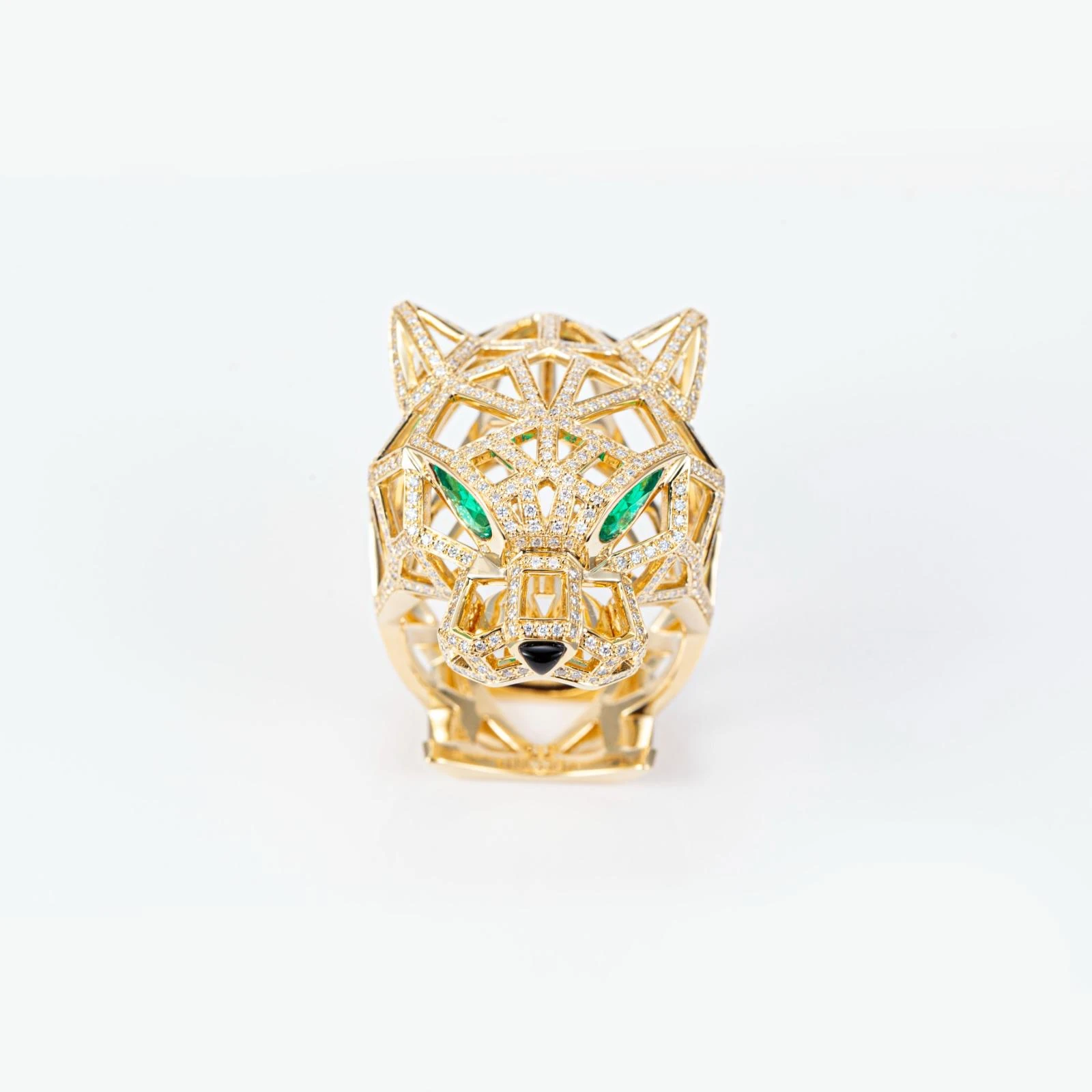 Intricate diamond-set panther ring with green eyes
